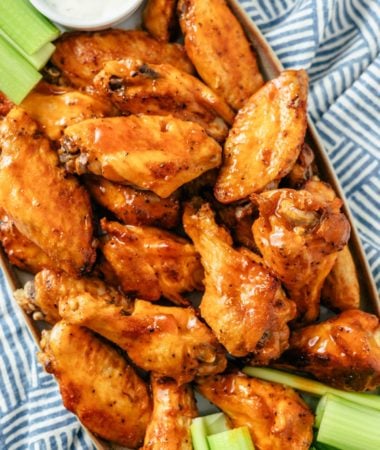 Succulent Slow Cooker Buffalo Wings, served alongside crisp celery sticks and a creamy mayo dip for a perfect balance of spicy and cooling flavors