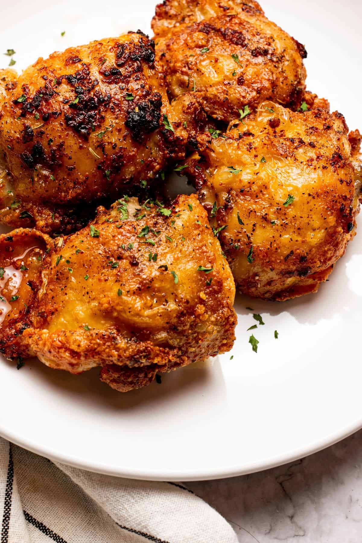 flavorful air fryer chicken thighs bone-in with parsley topping