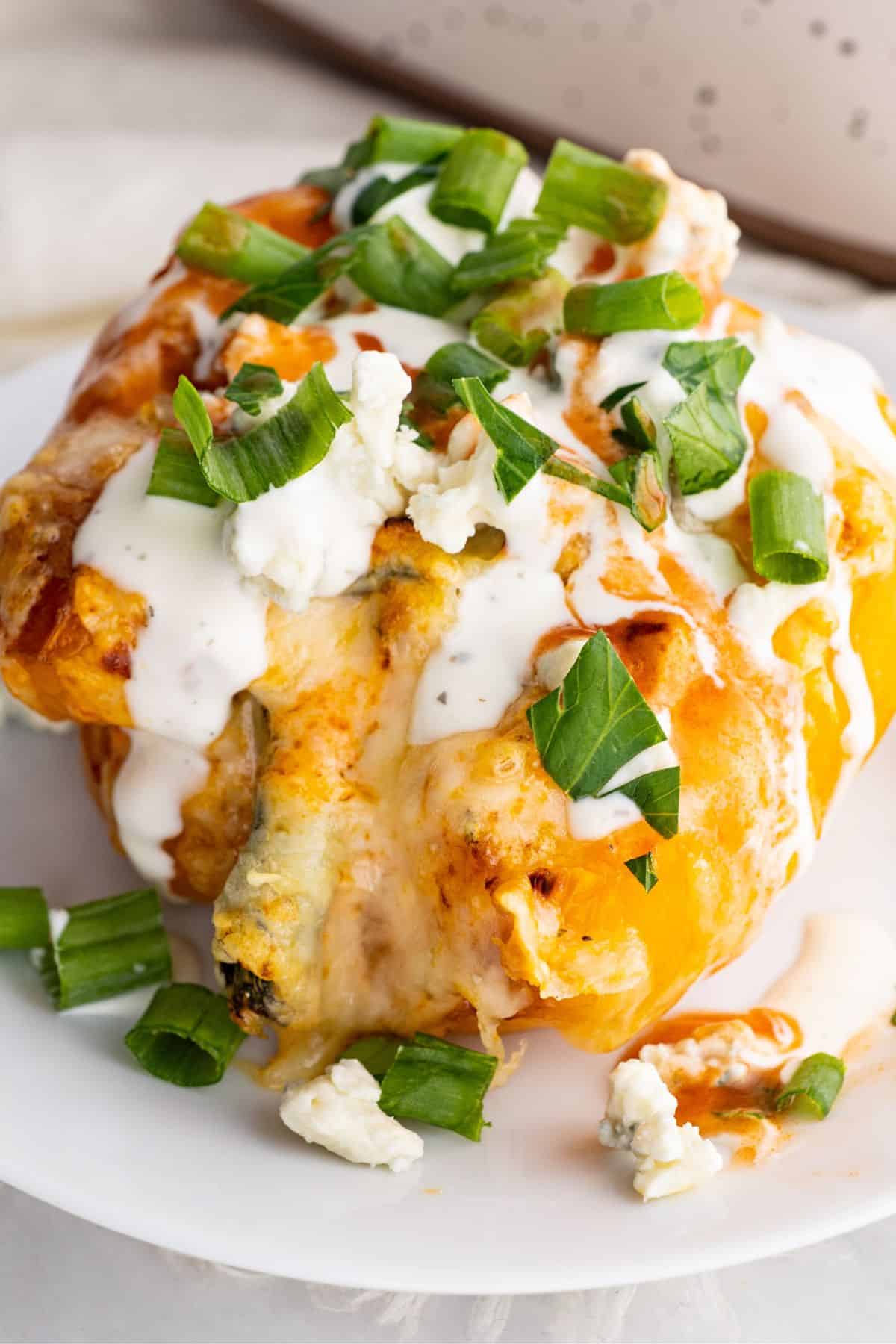 buffalo chicken stuffed pepper loaded with blue cheese crumbles and green onions, drizzled with ranch