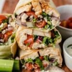 buffalo chicken wraps with fresh celery, dipping sauce, and extra blue cheese