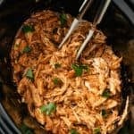 crockpot bbq chicken garnished with chopped parsley