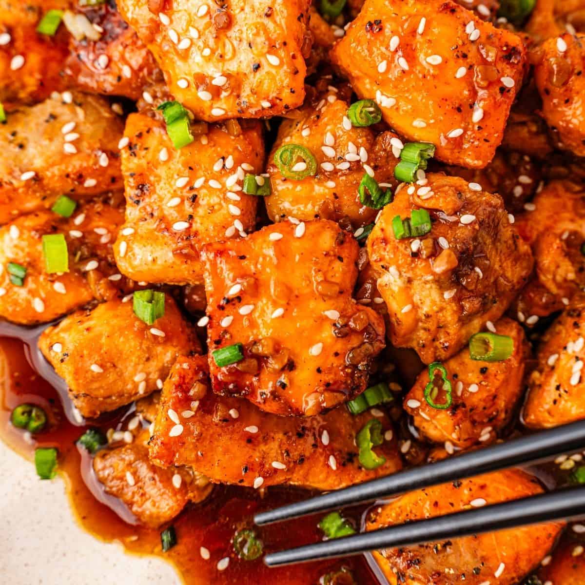 juicy honey garlic salmon bites coated with honey garlic sauce