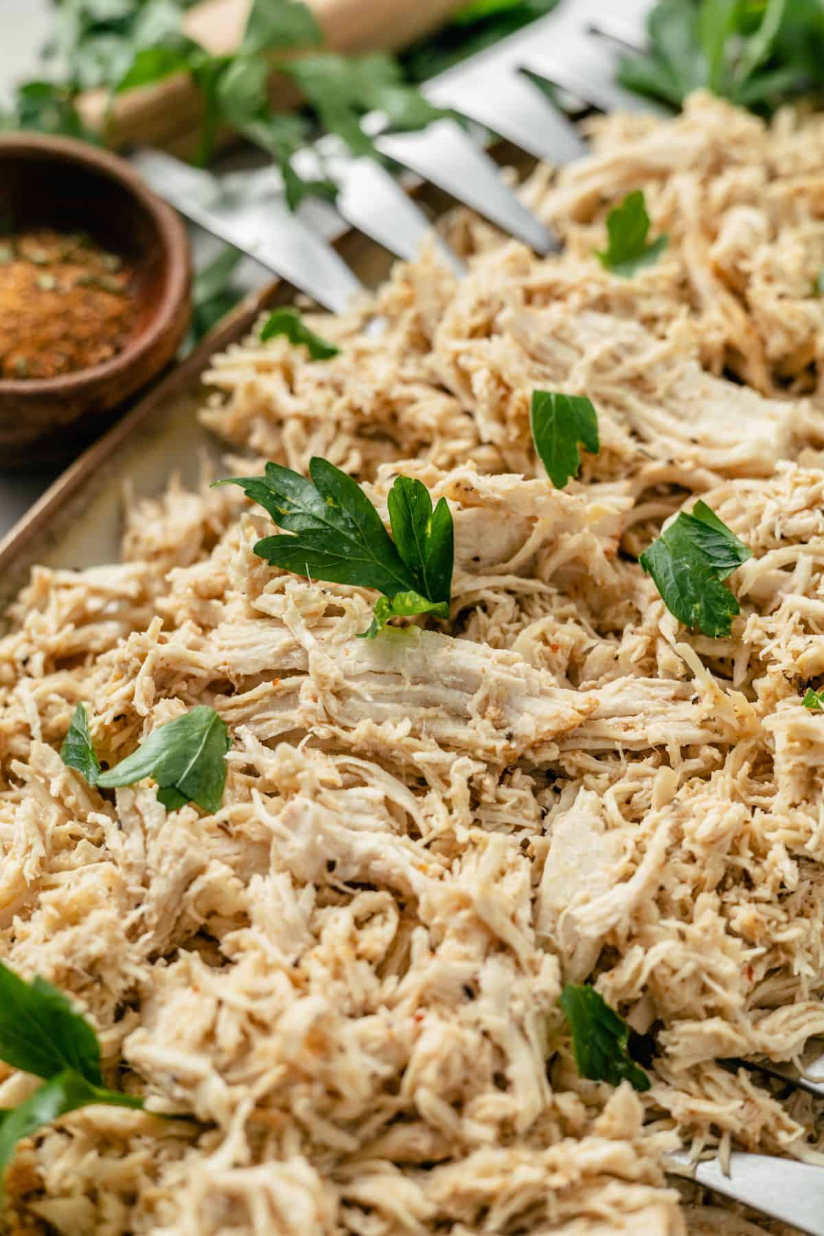 easy instant pot shredded chicken with herbs and spices on the side