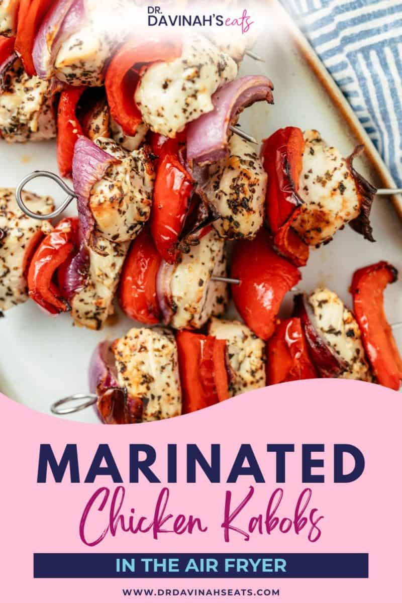 marinated chicken kabobs plated with sauce for dipping