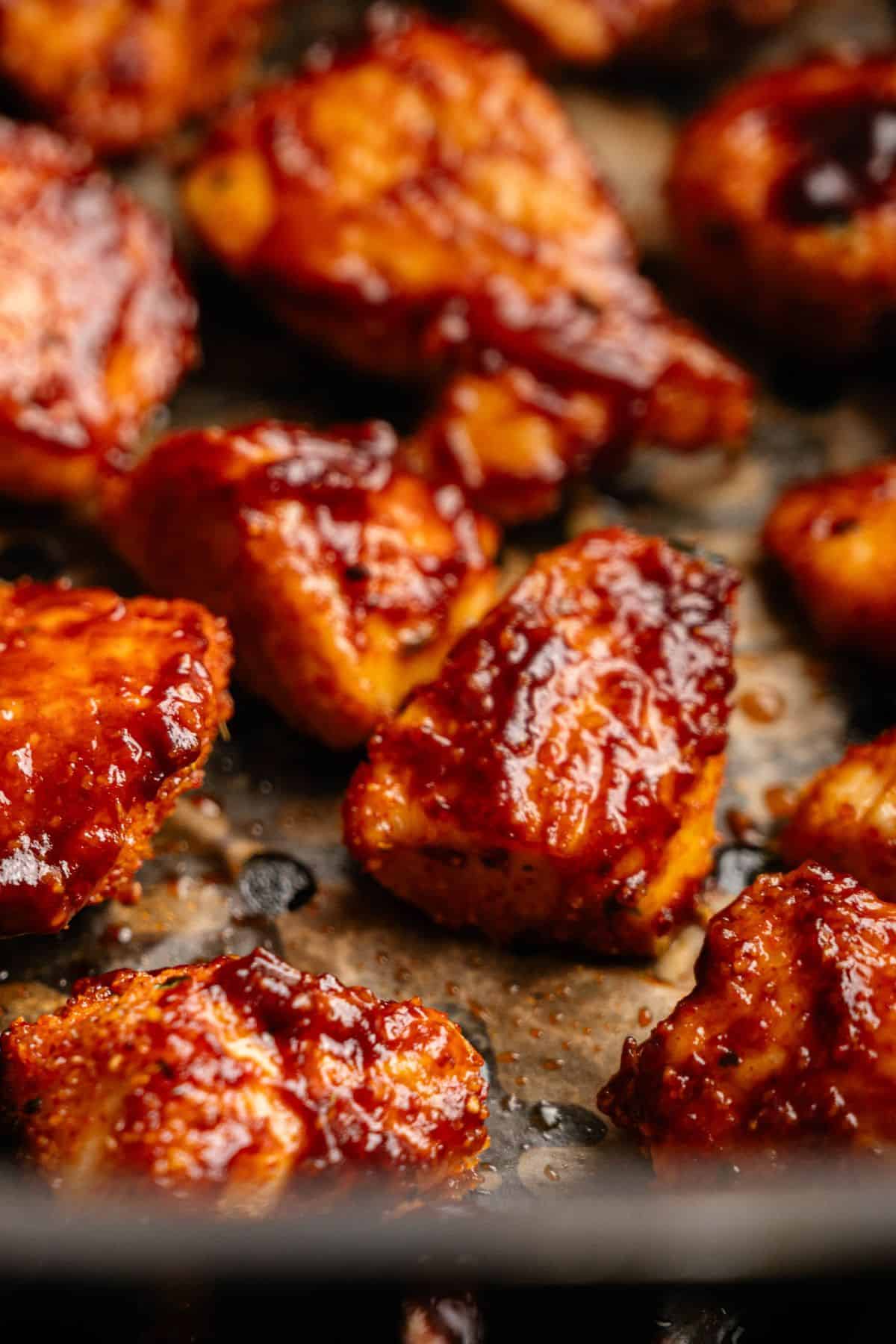 Bite-sized air fryer BBQ chicken pieces tossed in barbecue sauce