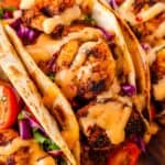 Vibrant blackened shrimp tacos ready for serving with fresh garnish
