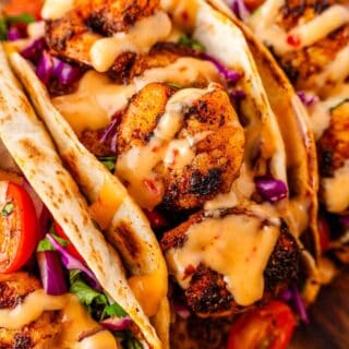 Vibrant blackened shrimp tacos ready for serving with fresh garnish