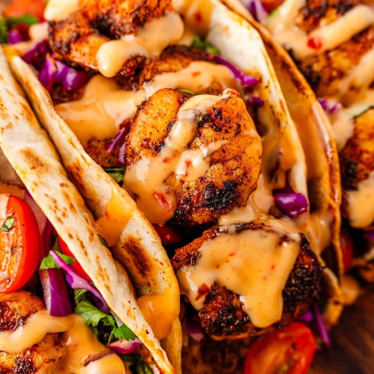 Vibrant blackened shrimp tacos ready for serving with fresh garnish