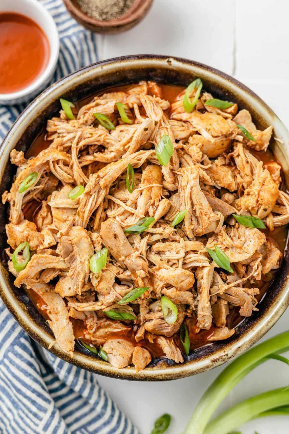 Bowl of flavorful buffalo chicken, tender, juicy, and ready to serve