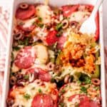 Low-carb Italian sausage stuffed peppers topped with melted cheese