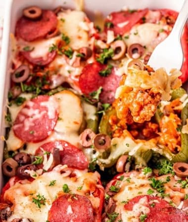 Low-carb Italian sausage stuffed peppers topped with melted cheese