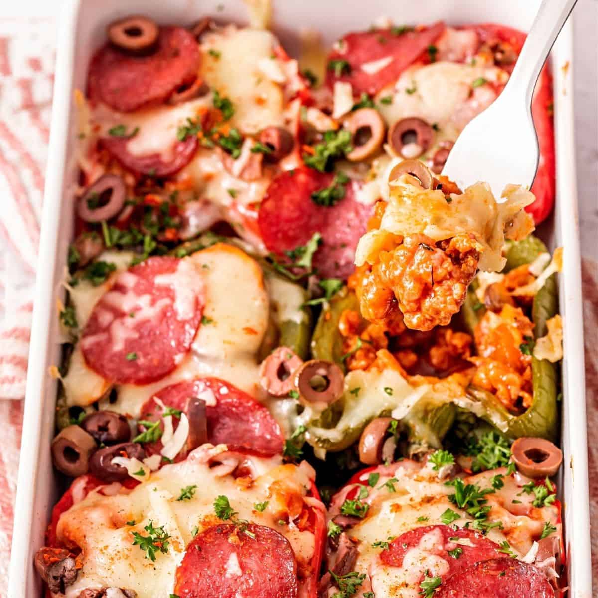 Low-carb Italian sausage stuffed peppers topped with melted cheese