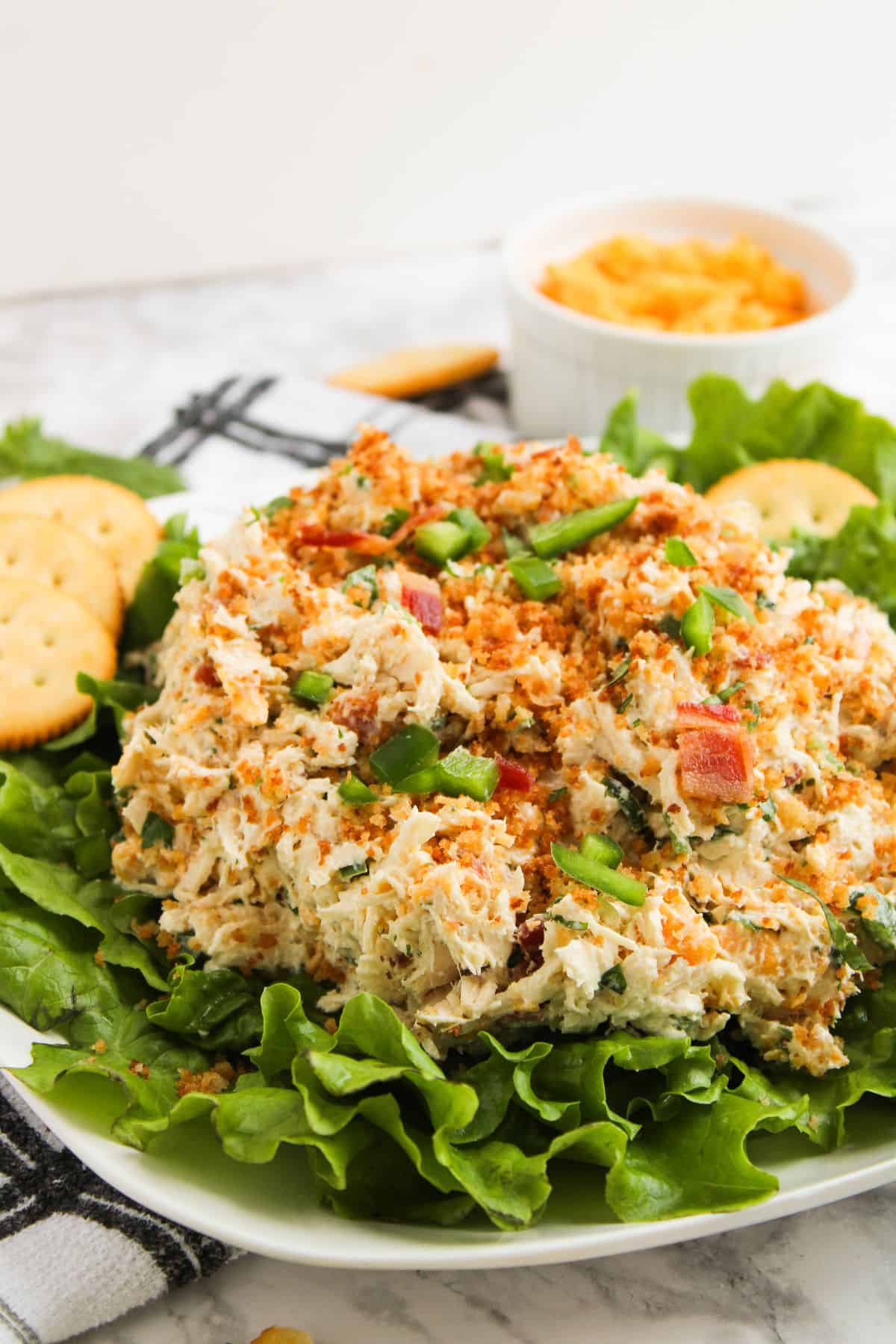 Colorful chicken salad with creamy dressing, jalapeños, bacon, and cheddar cheese