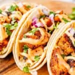 Weeknight dinner salmon tacos with bold blackened flavor and fresh slaw