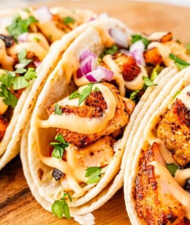 Weeknight dinner salmon tacos with bold blackened flavor and fresh slaw