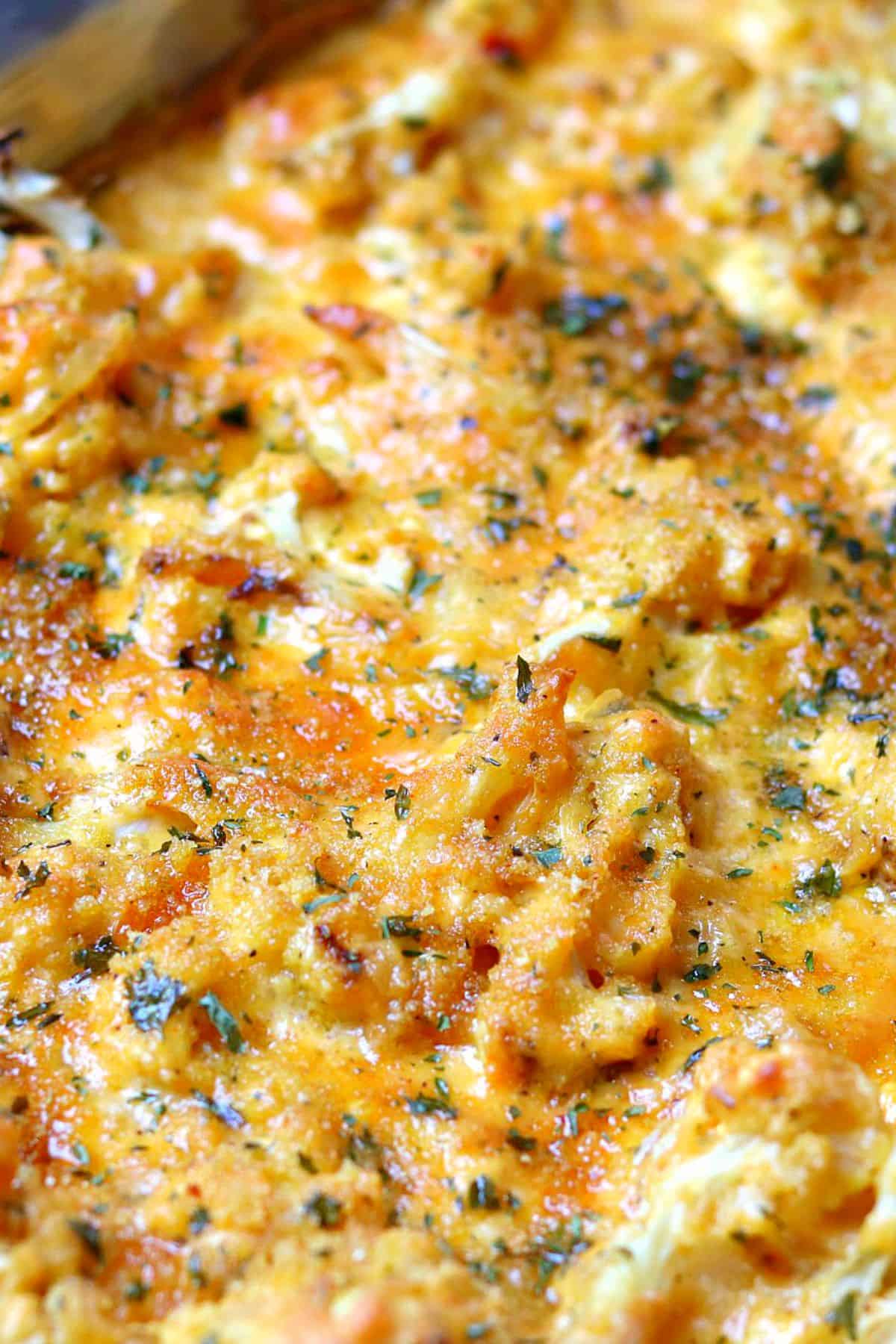 close-up of the top of baked cauliflower Mac and cheese in a pan