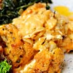 cauliflower Mac and cheese on a plate with collard greens and ribs