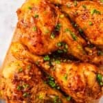Crispy chicken drumsticks coated in thick honey garlic sauce