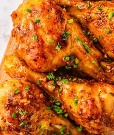 Crispy chicken drumsticks coated in thick honey garlic sauce