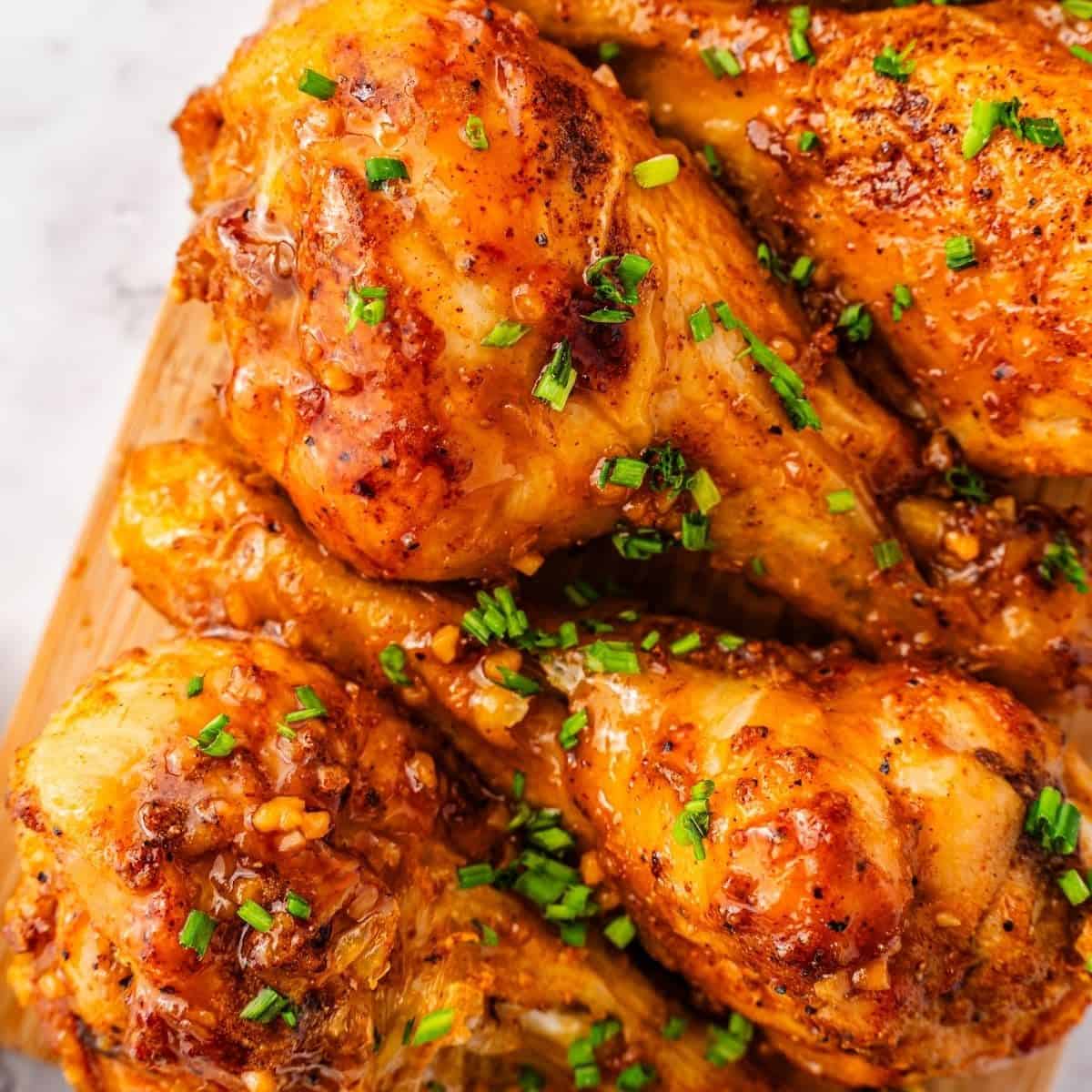 Crispy chicken drumsticks coated in thick honey garlic sauce