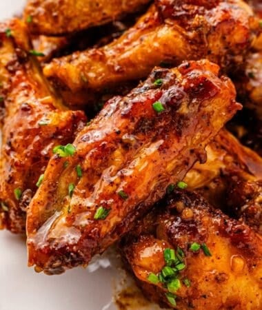 Air fryer honey garlic wings with crispy skin and garlic sauce
