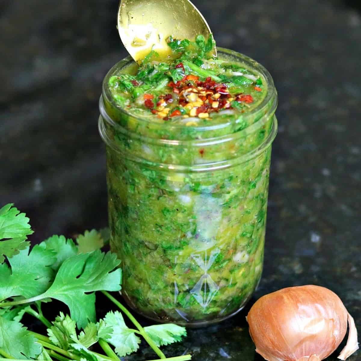 chimichurri sauce with red pepper flakes on top