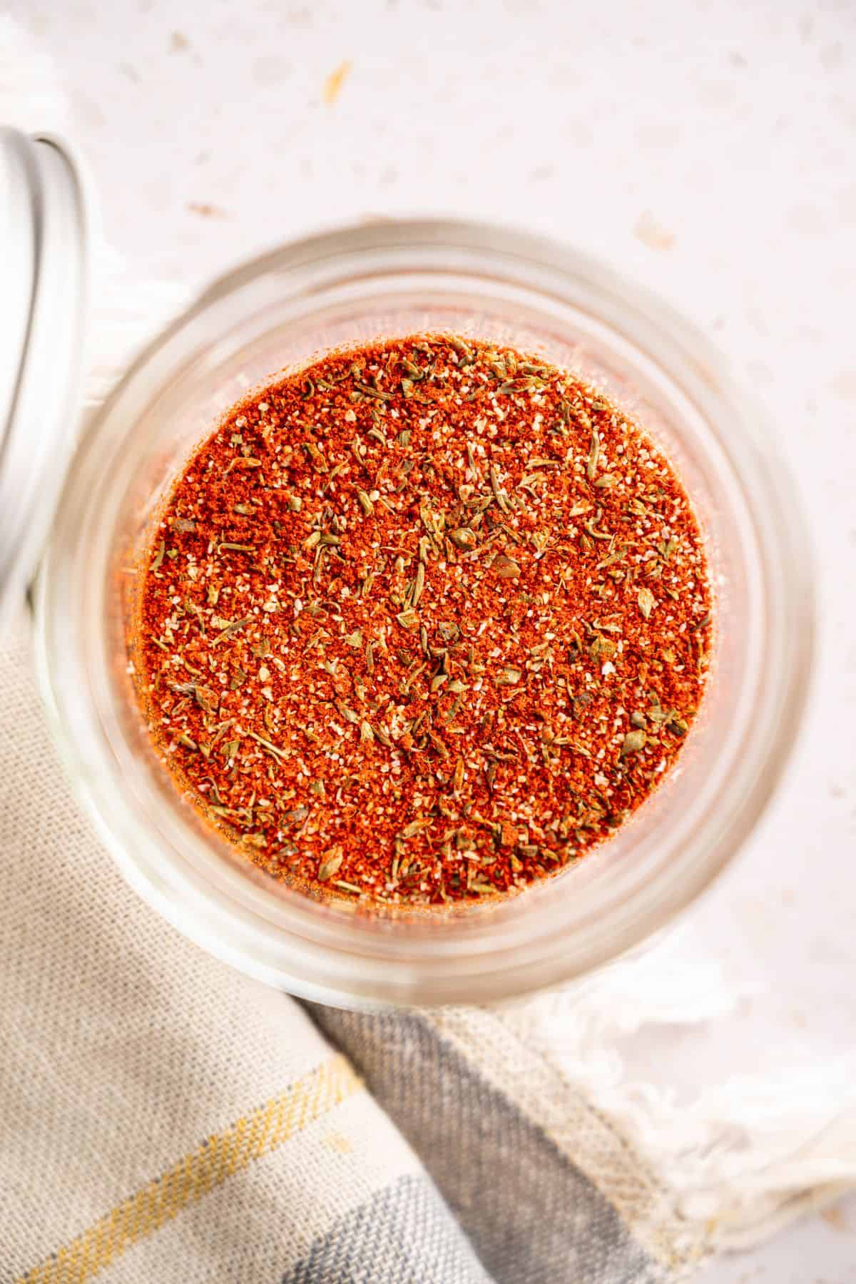 Creole seasoning blend in a bowl, showing a mix of paprika, herbs, and spices