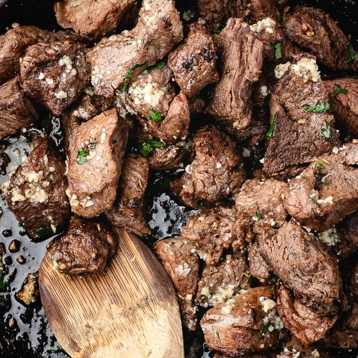 easy tender garlic butter steak bites in a skillet