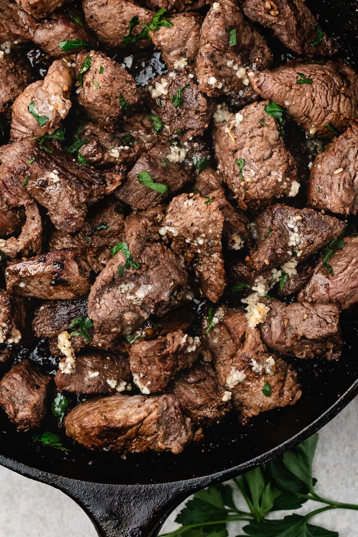 close up view of steak bites with garlic butter