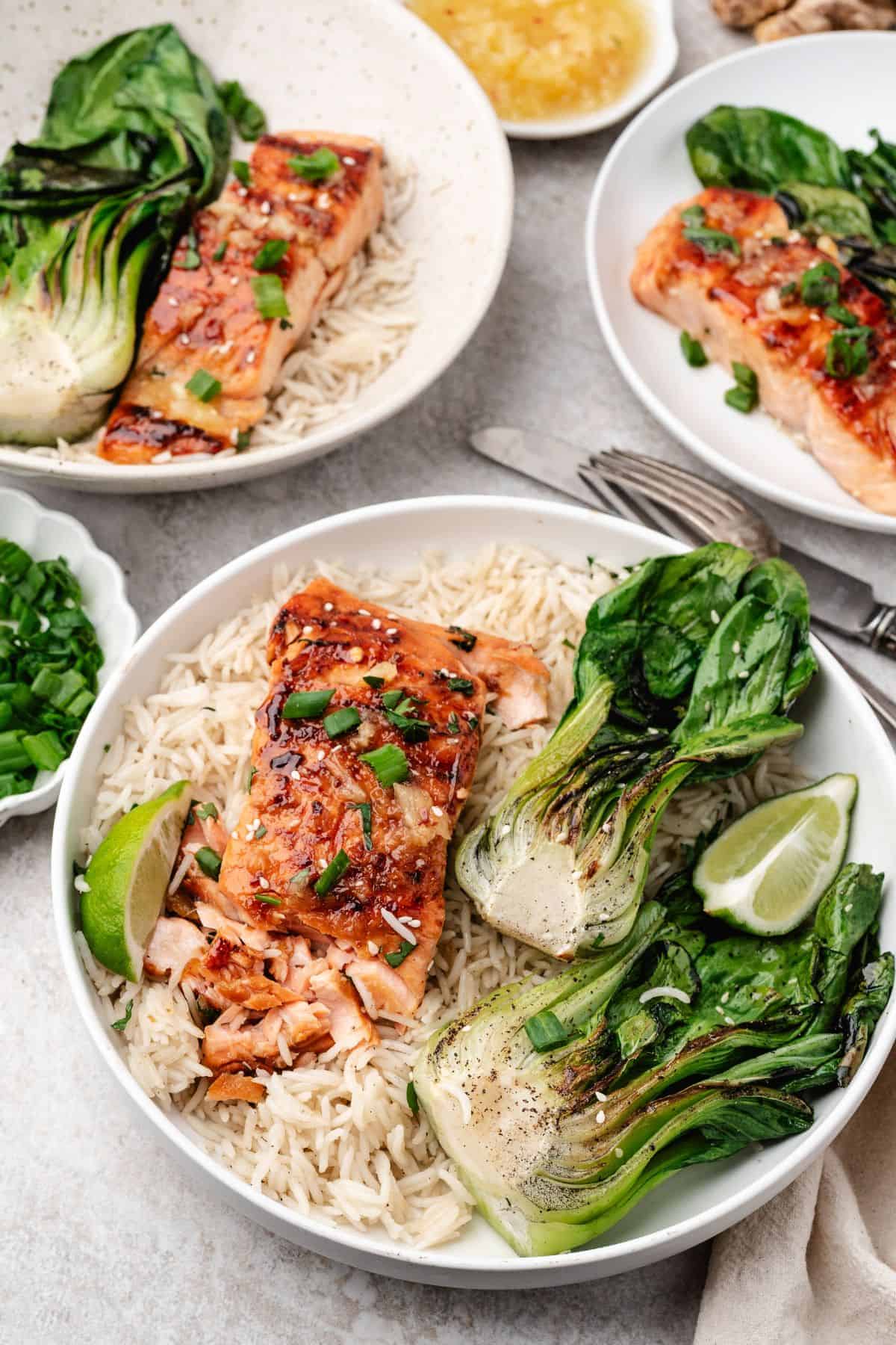Plated miso salmon dinner with a rich glaze, rice, and bright green bok choy