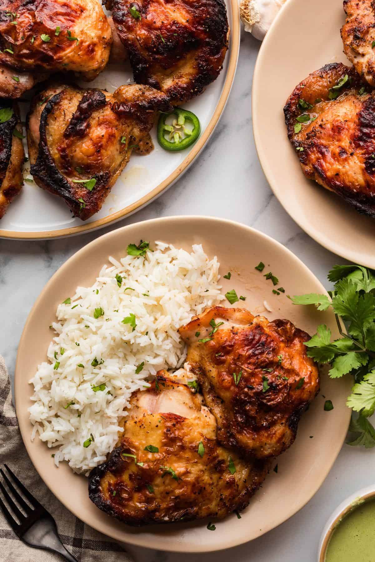 Crispy skin Peruvian chicken with smoky marinade and a bed of rice