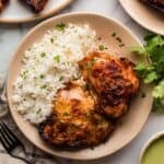 Tender baked chicken with Peruvian spices served with rice and sauce