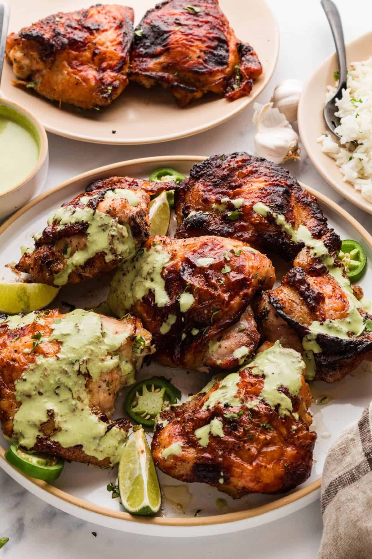 Grilled chicken breasts topped with Peruvian green sauce