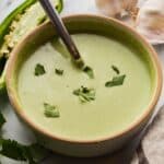 Peruvian green sauce in a bowl, ready to add bold flavor to meals.