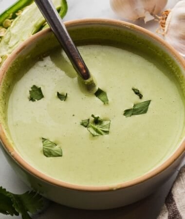 Peruvian green sauce in a bowl, ready to add bold flavor to meals.