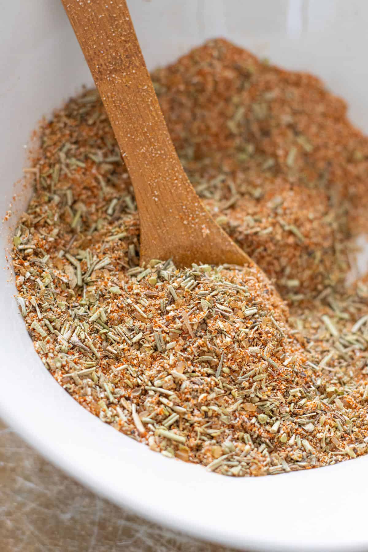 Rustic bowl of rotisserie chicken spice blend ready for roasting