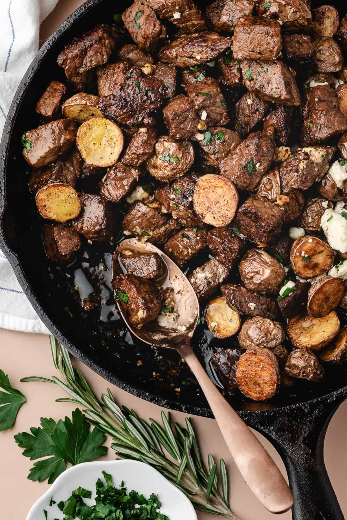 Bite-sized steak pieces with crispy potatoes, topped with savory blue cheese crumbles