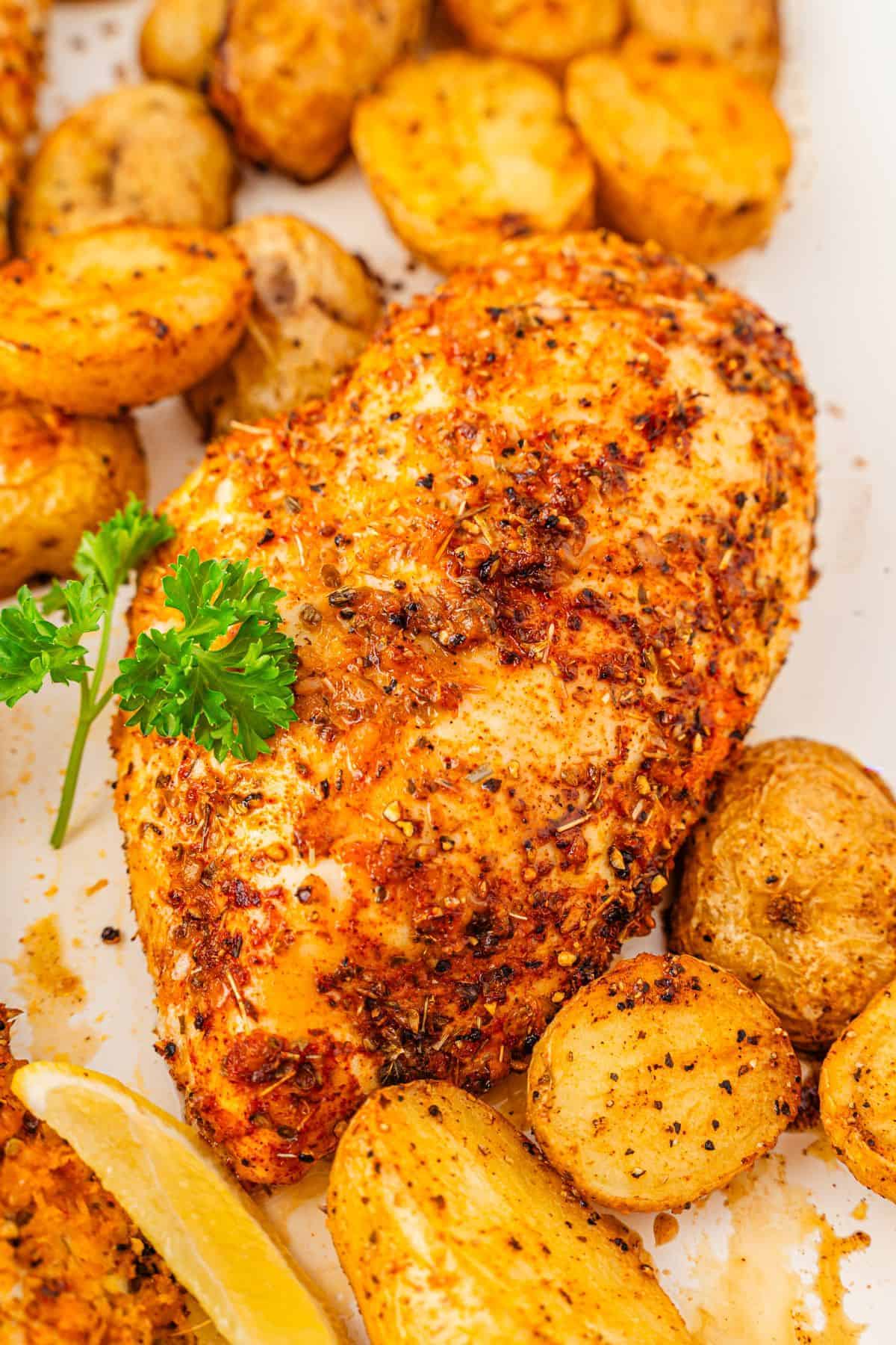 Lemon and herb chicken baked with potatoes on a single pan