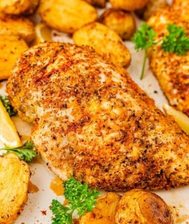 Easy sheet pan chicken dinner with tender potatoes and savory pan juices