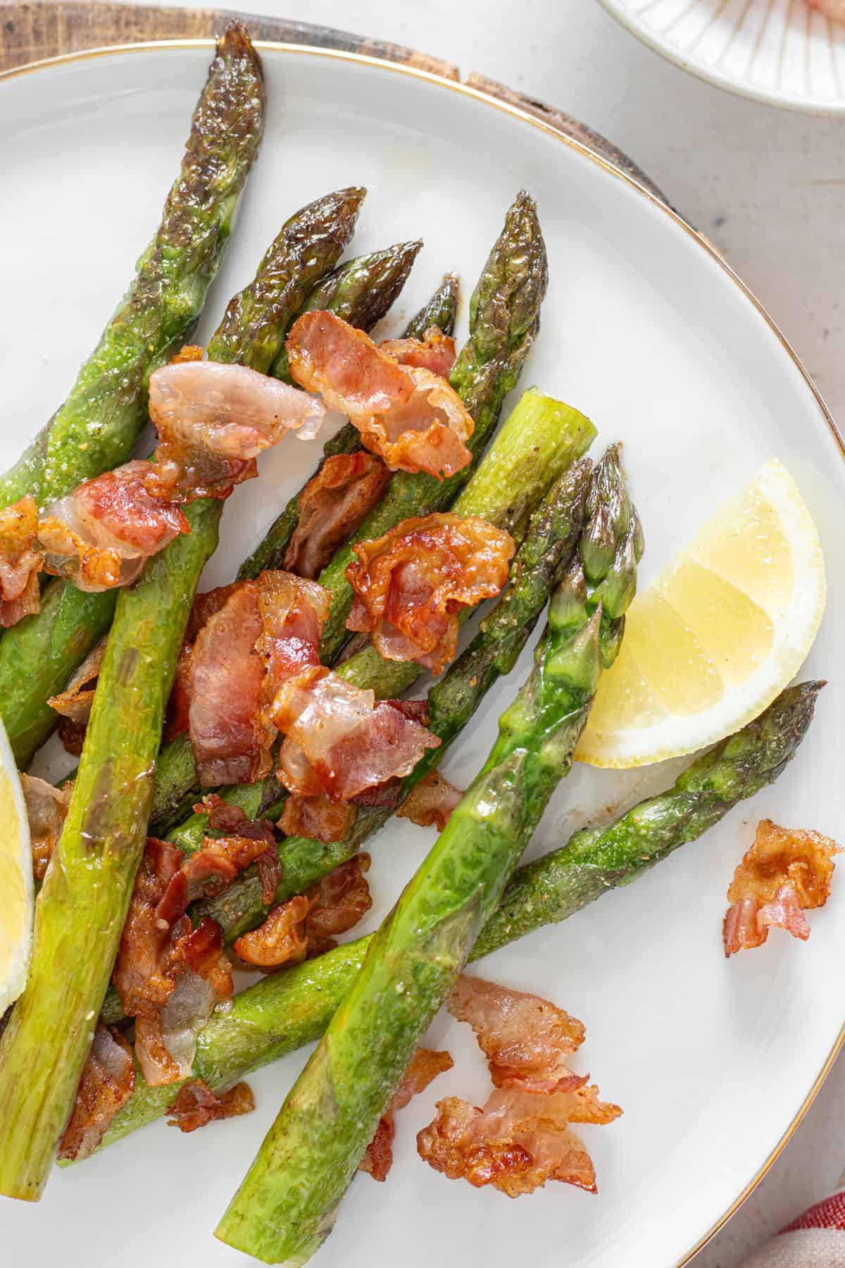 Asparagus cooked with bacon in a skillet for a flavorful side