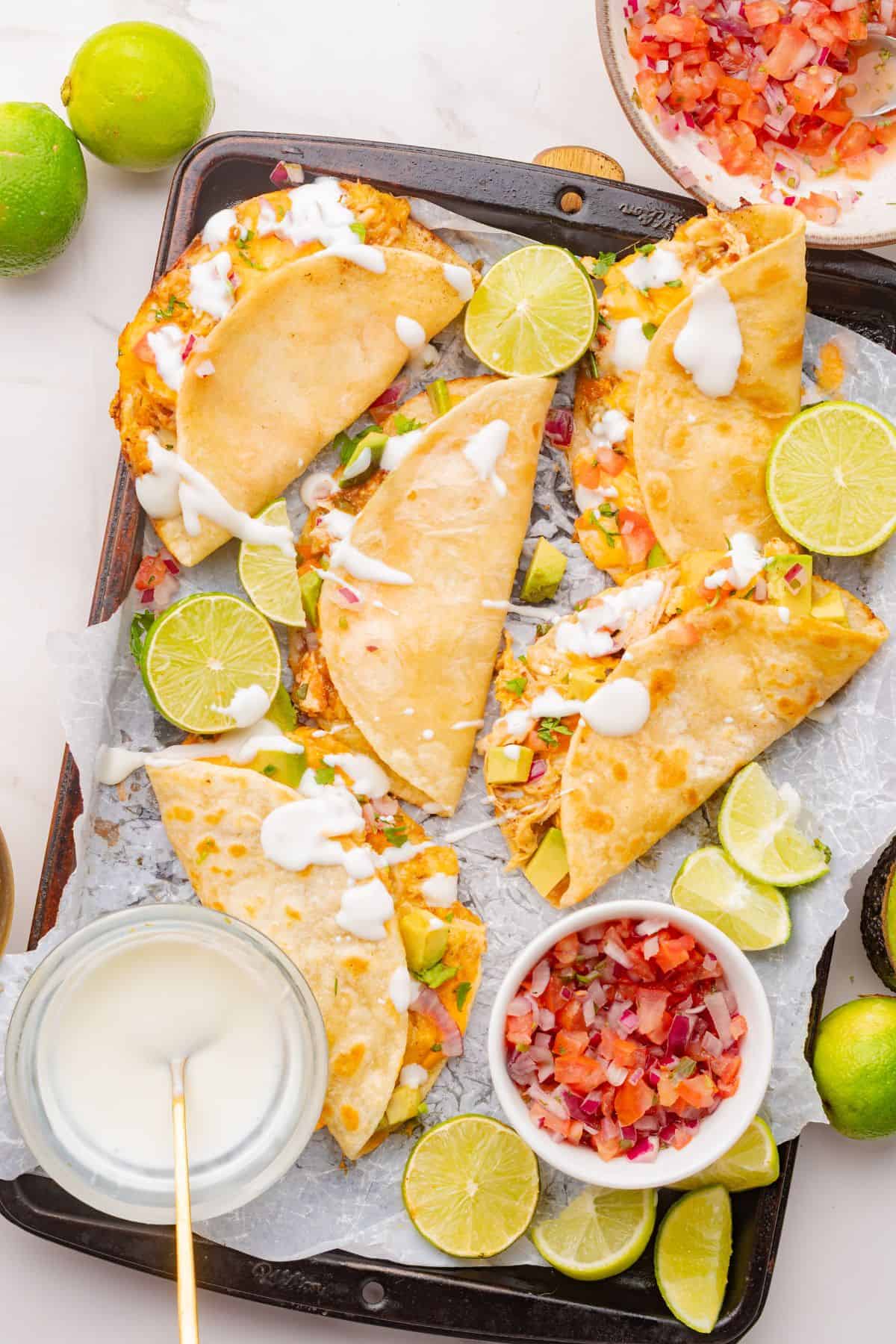 Crispy oven-baked chicken tacos with melted cheese and seasoned chicken