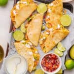 Shredded chicken tacos baked until tortillas are golden and crisp