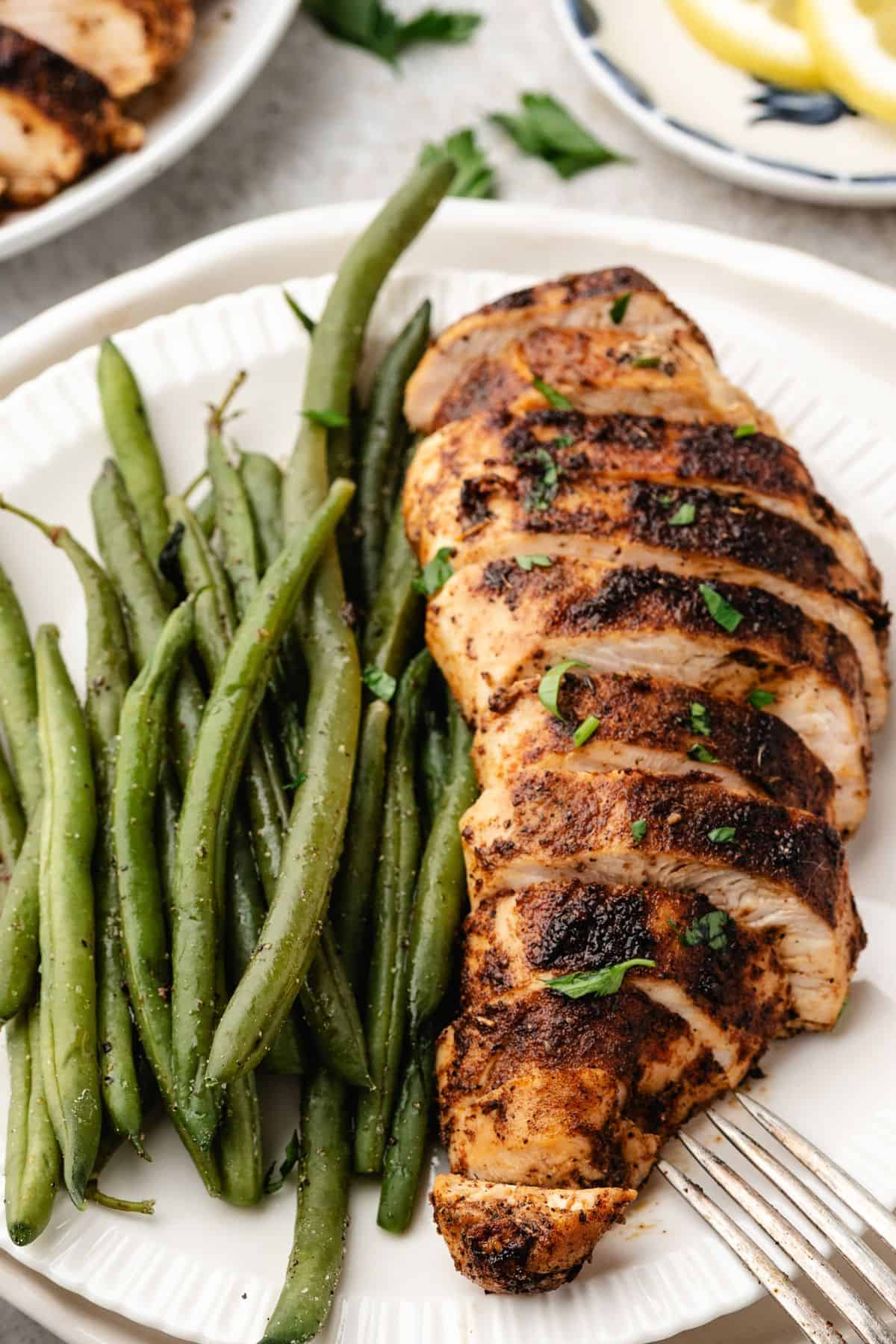 Well-seasoned blackened chicken breast with smoky spice rub served with green beans