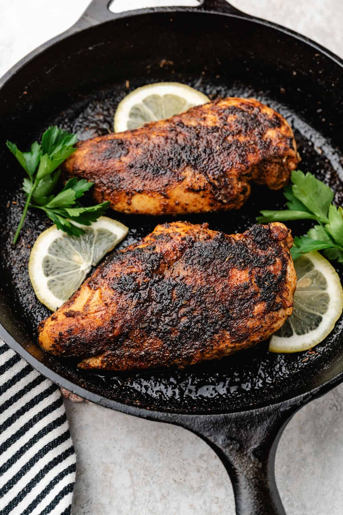 Flavorful blackened chicken with crispy spice-coated surface in a skillet