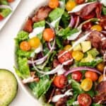bacon, lettuce and tomato salad with avocado and ranch dressing in a bowl