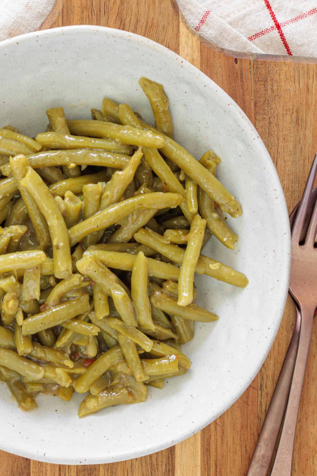Buttered canned green beans served as a last-minute side dish