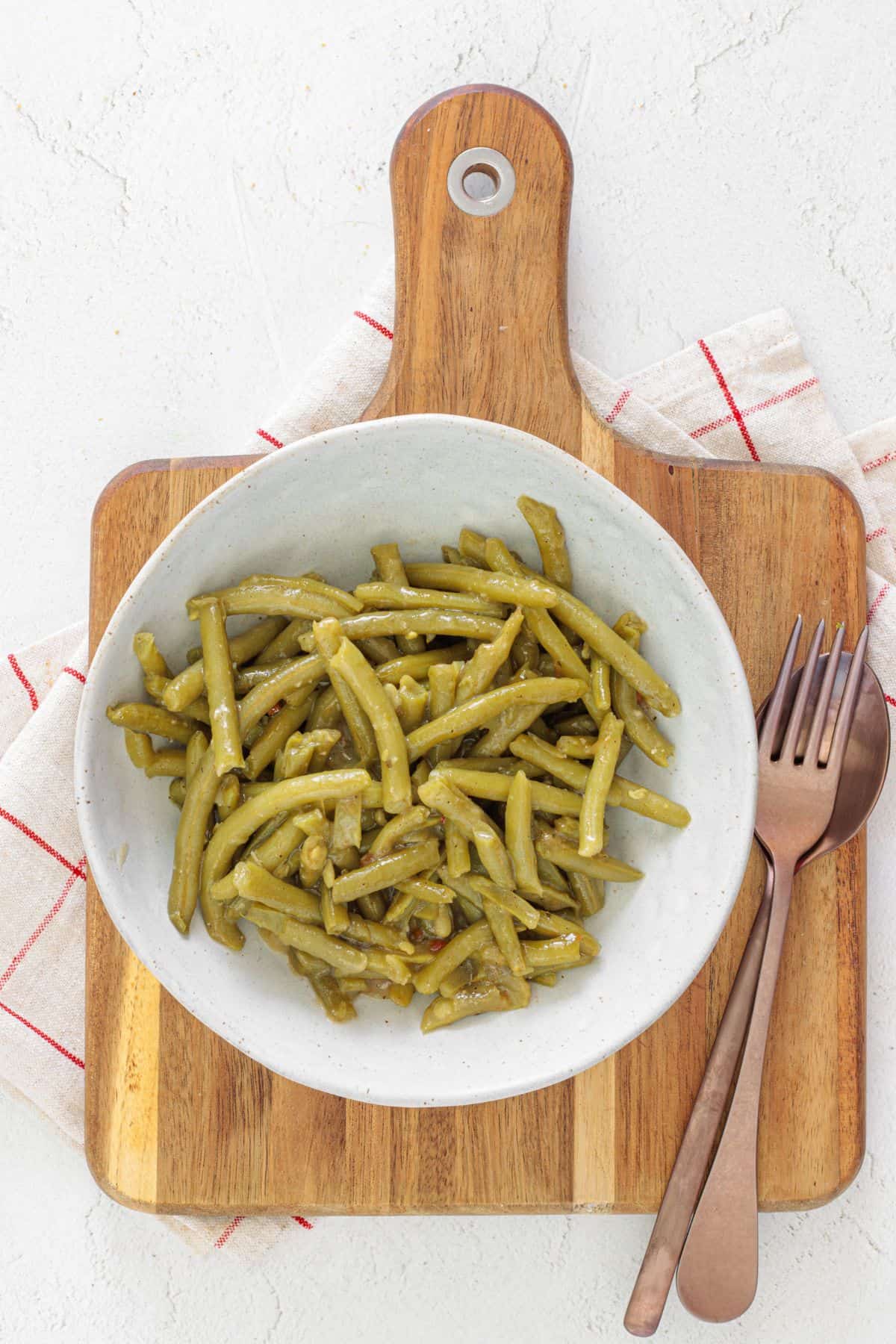 Plate of canned green beans saut&eacute;ed to tender perfection