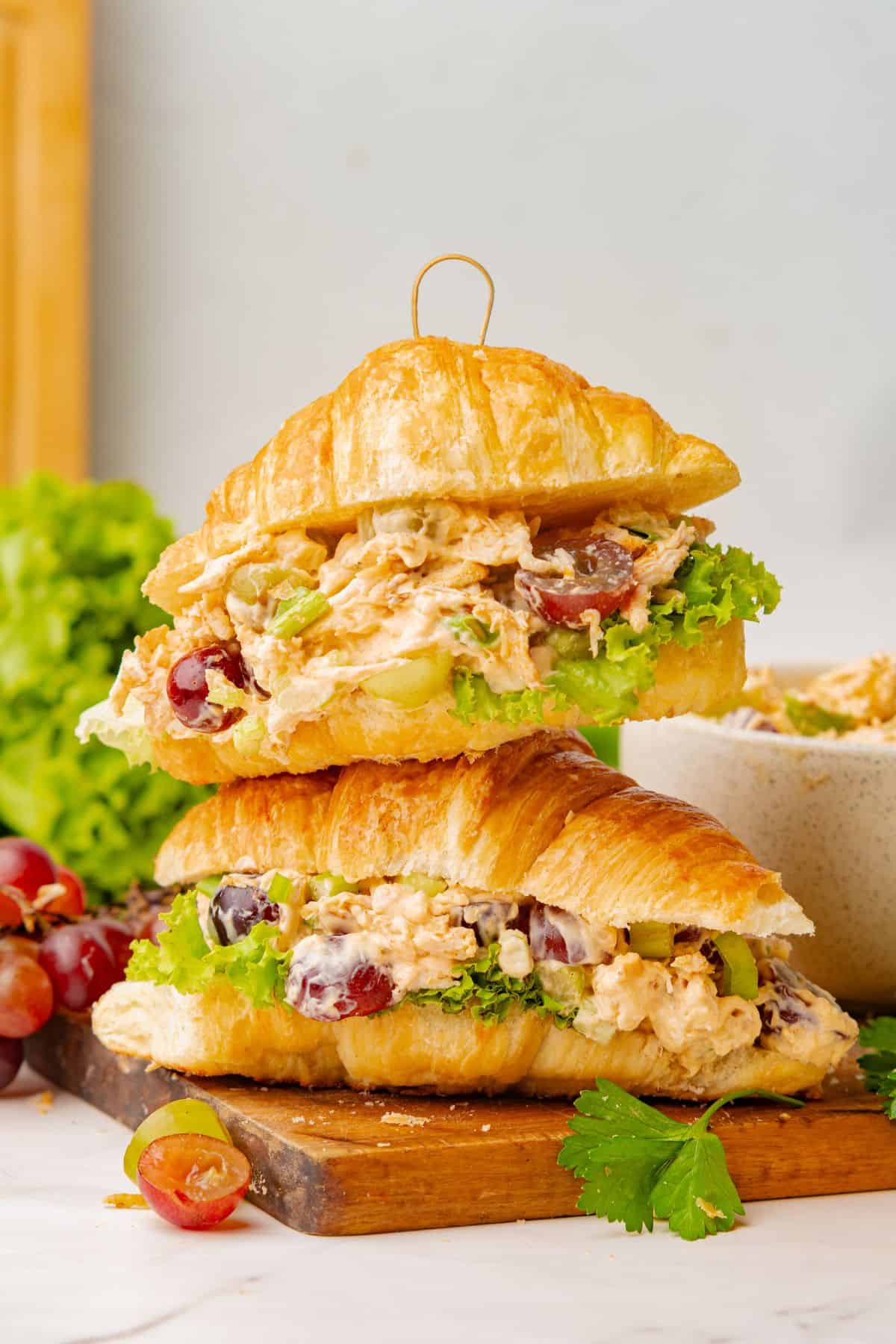 Light lunch croissant filled with chicken salad and juicy grapes