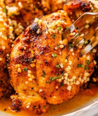 Tender, golden lemon garlic chicken thighs served in a bowl