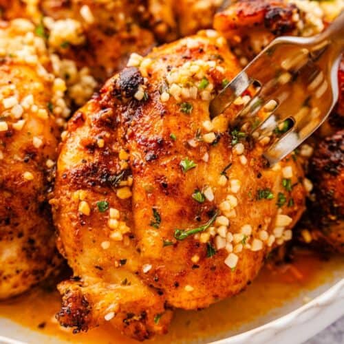 Tender, golden lemon garlic chicken thighs served in a bowl